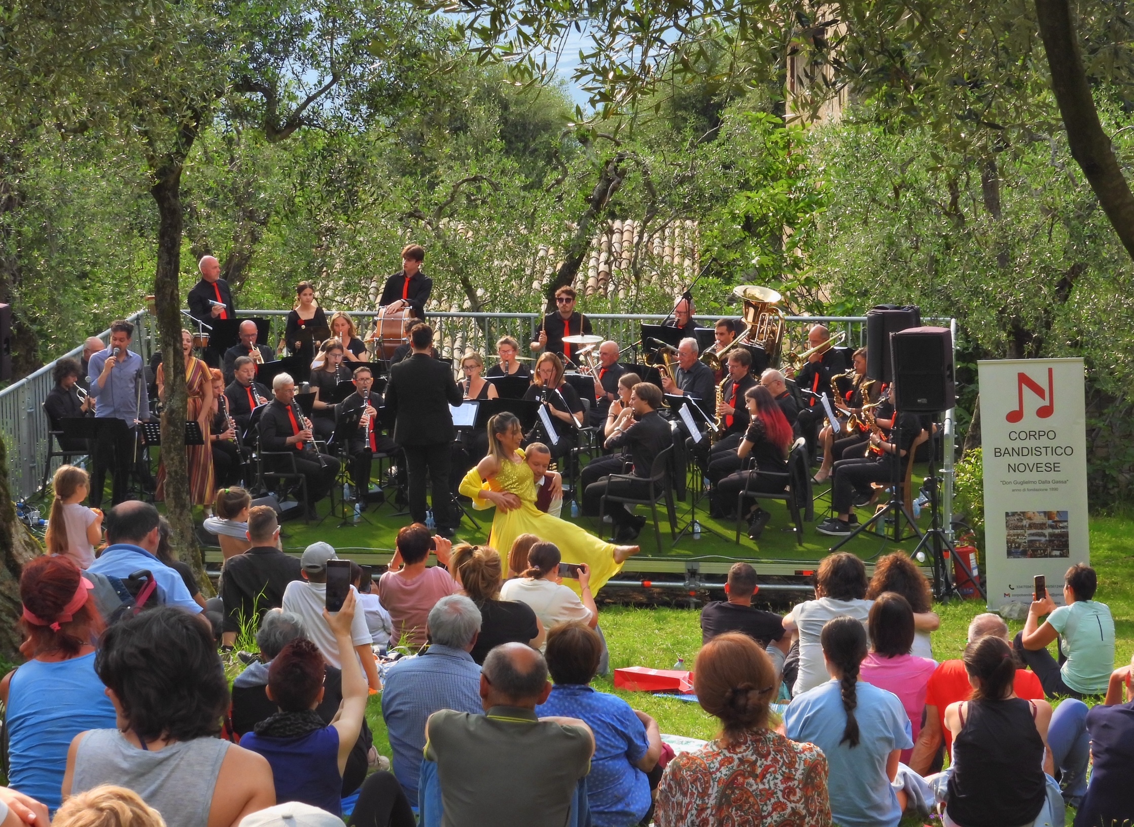 Outdoor concert by the Corpo Bandistico Novese at the Teatro degli Ulivi in Campo di Brenzone on Lake Garda.